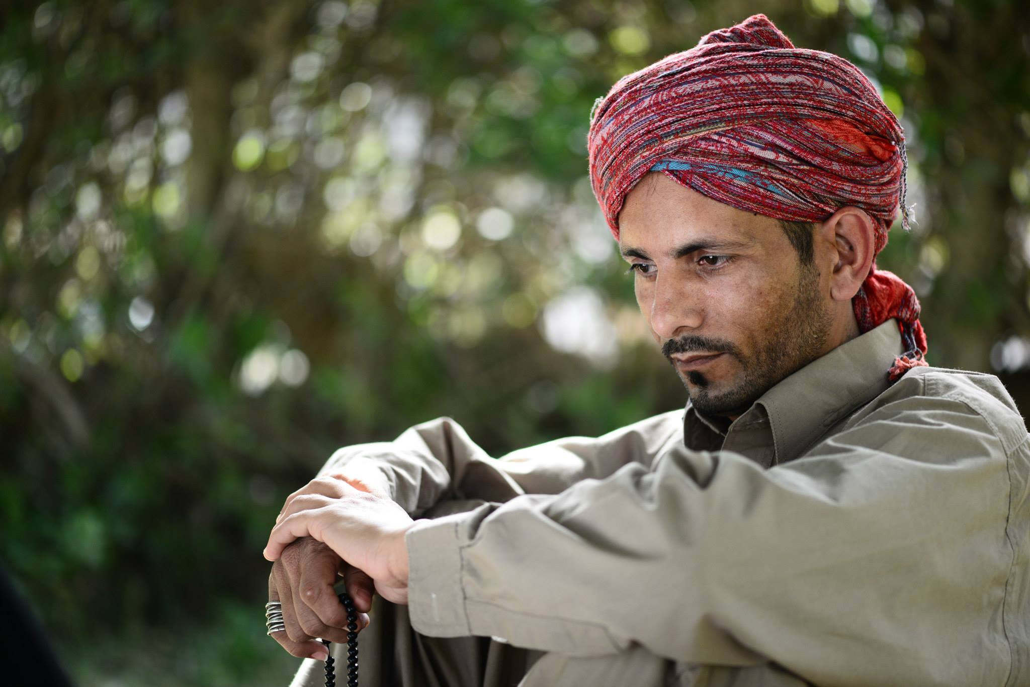 Portrait of a man in red turban